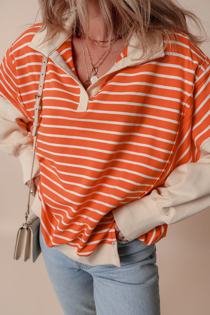 Sweat-shirt à rayures orange et blocs de couleur, coupe ample, col et épaules tombantes