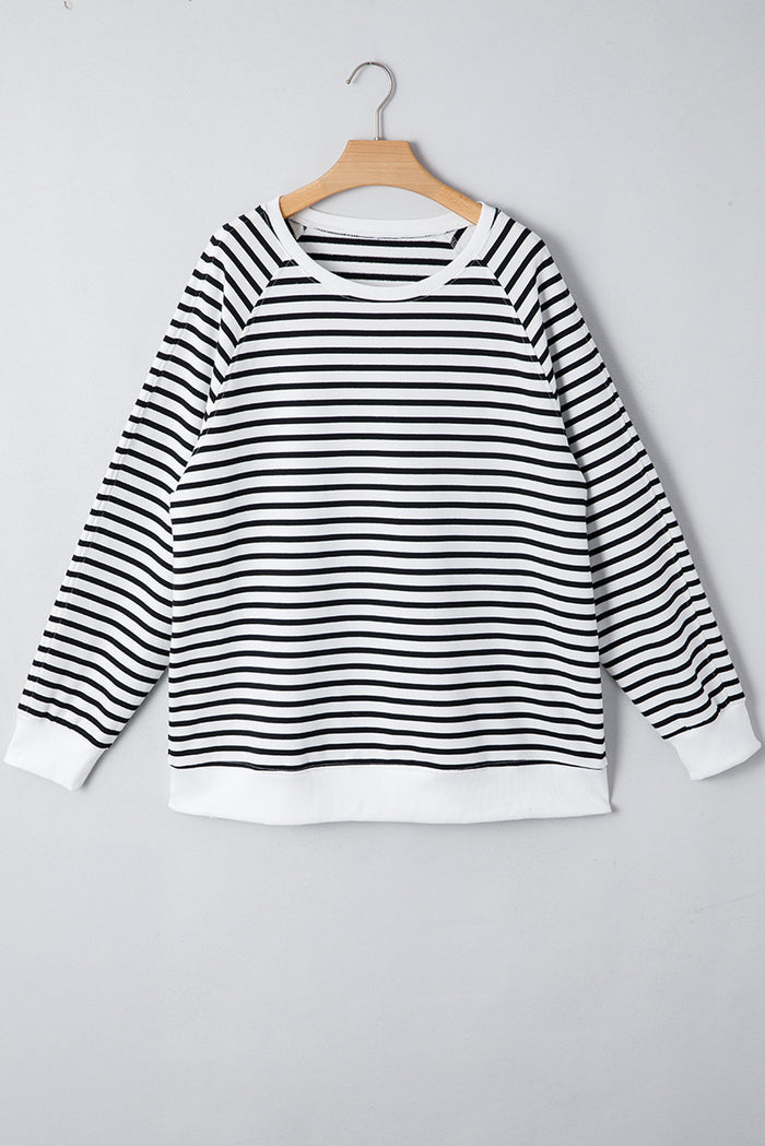Sweat-shirt ample à rayures noires, manches raglan, fentes latérales