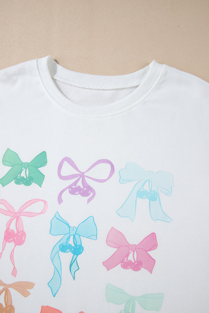 Sweat-shirt ample blanc à motif de nœud papillon et épaules tombantes