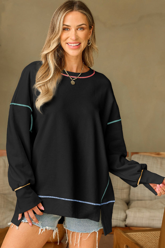 Sweat-shirt ample noir fendu à coutures contrastées