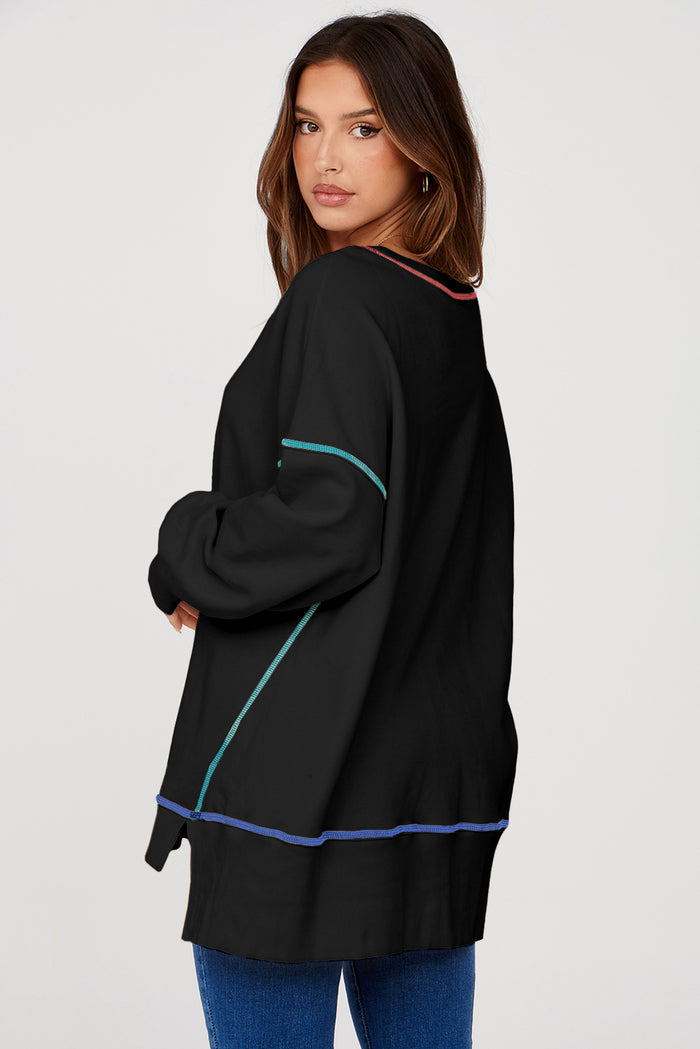 Sweat-shirt ample noir fendu à coutures contrastées