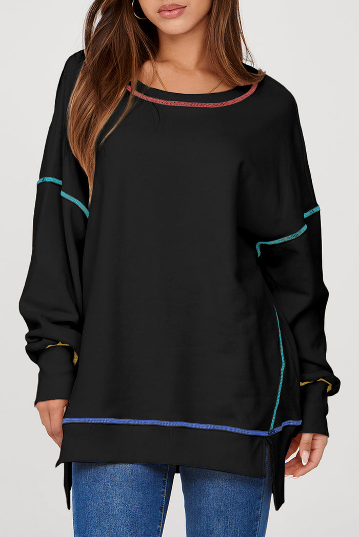 Sweat-shirt ample noir fendu à coutures contrastées