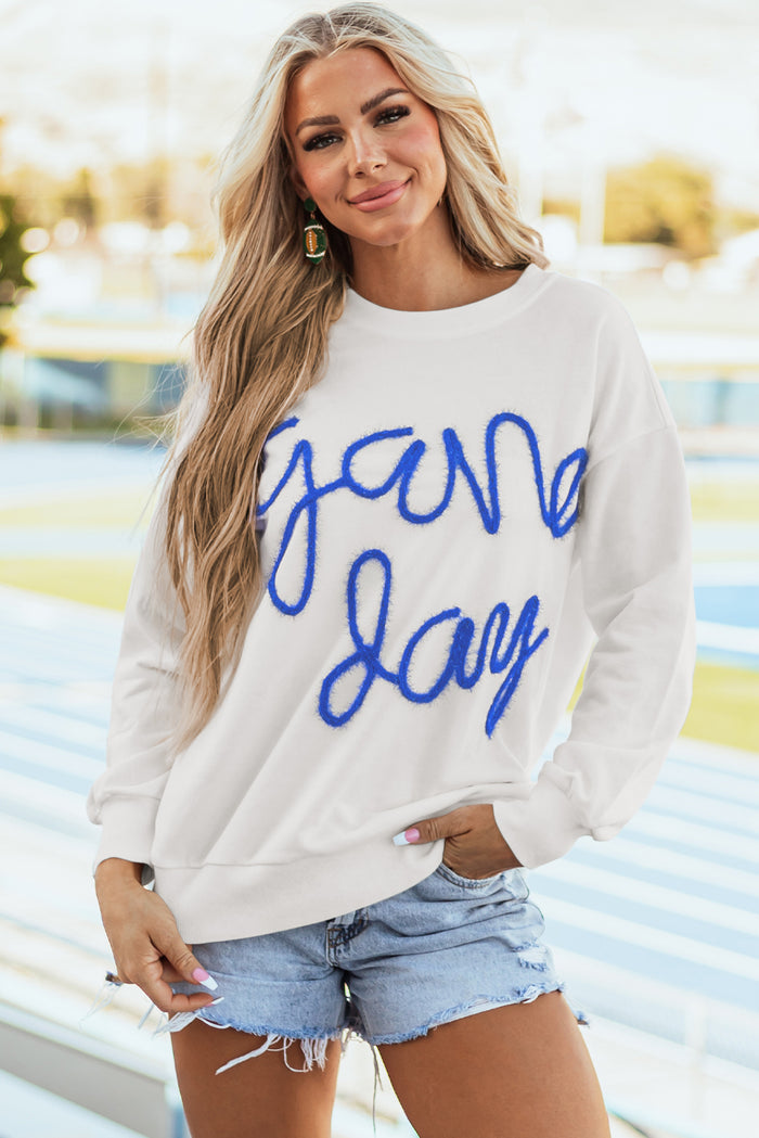 Sweat-shirt graphique blanc Tinsel Game Day à épaules tombantes