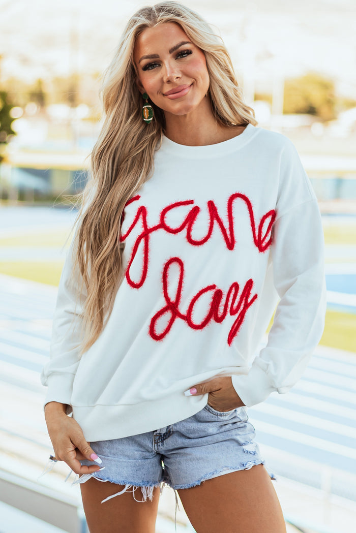 Sweat-shirt graphique blanc Tinsel Game Day à épaules tombantes
