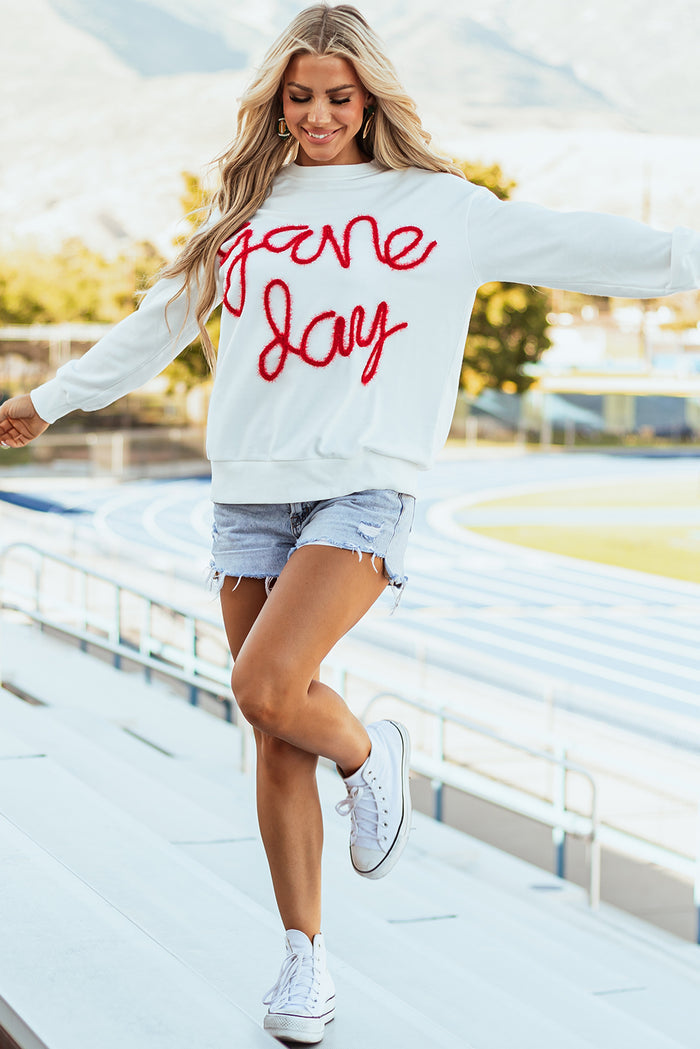 Sweat-shirt graphique blanc Tinsel Game Day à épaules tombantes