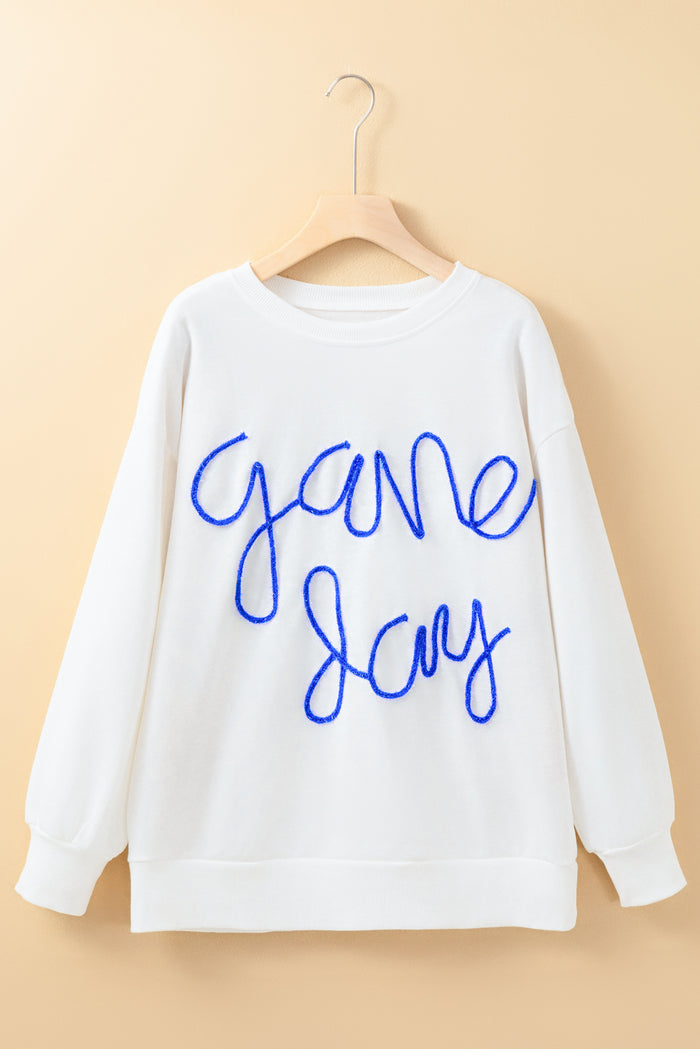 Sweat-shirt graphique blanc Tinsel Game Day à épaules tombantes