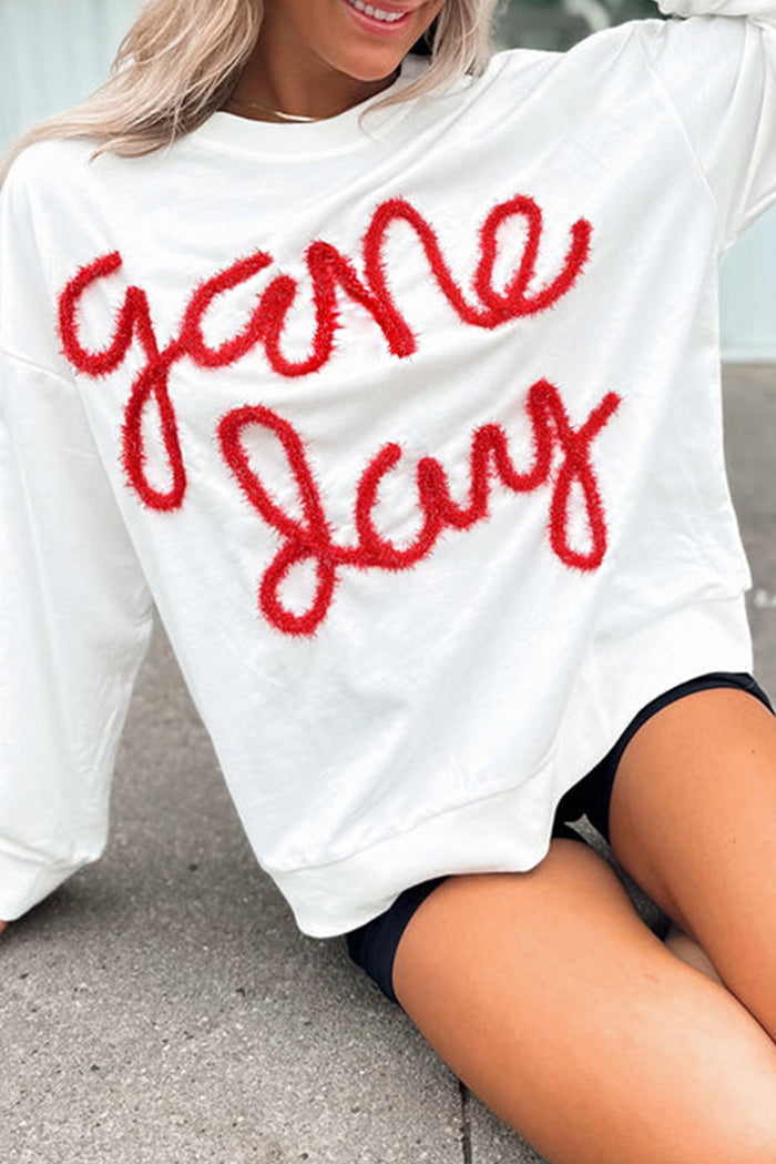 Sweat-shirt graphique blanc Tinsel Game Day à épaules tombantes