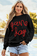 Sweat-shirt graphique noir à épaules tombantes Tinsel Game Day
