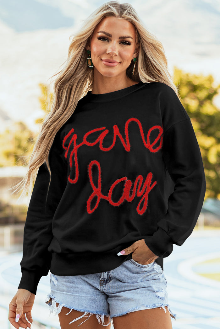 Sweat-shirt graphique noir à épaules tombantes Tinsel Game Day