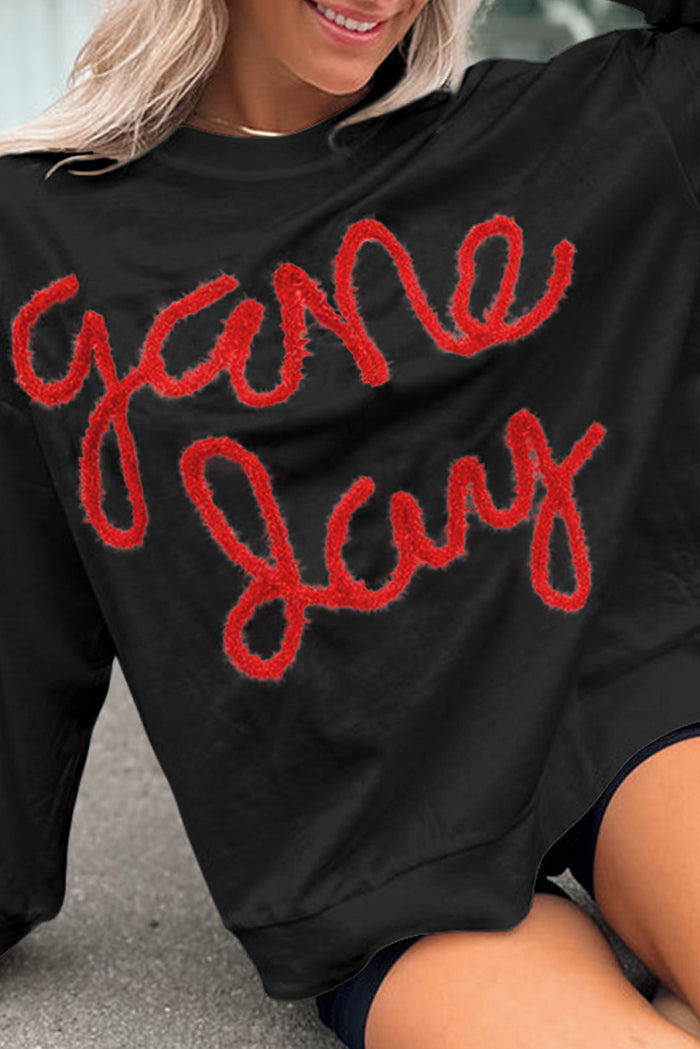 Sweat-shirt graphique noir à épaules tombantes Tinsel Game Day