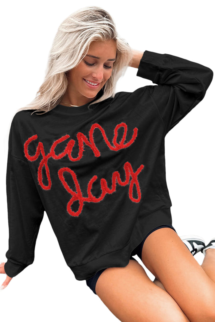 Sweat-shirt graphique noir à épaules tombantes Tinsel Game Day