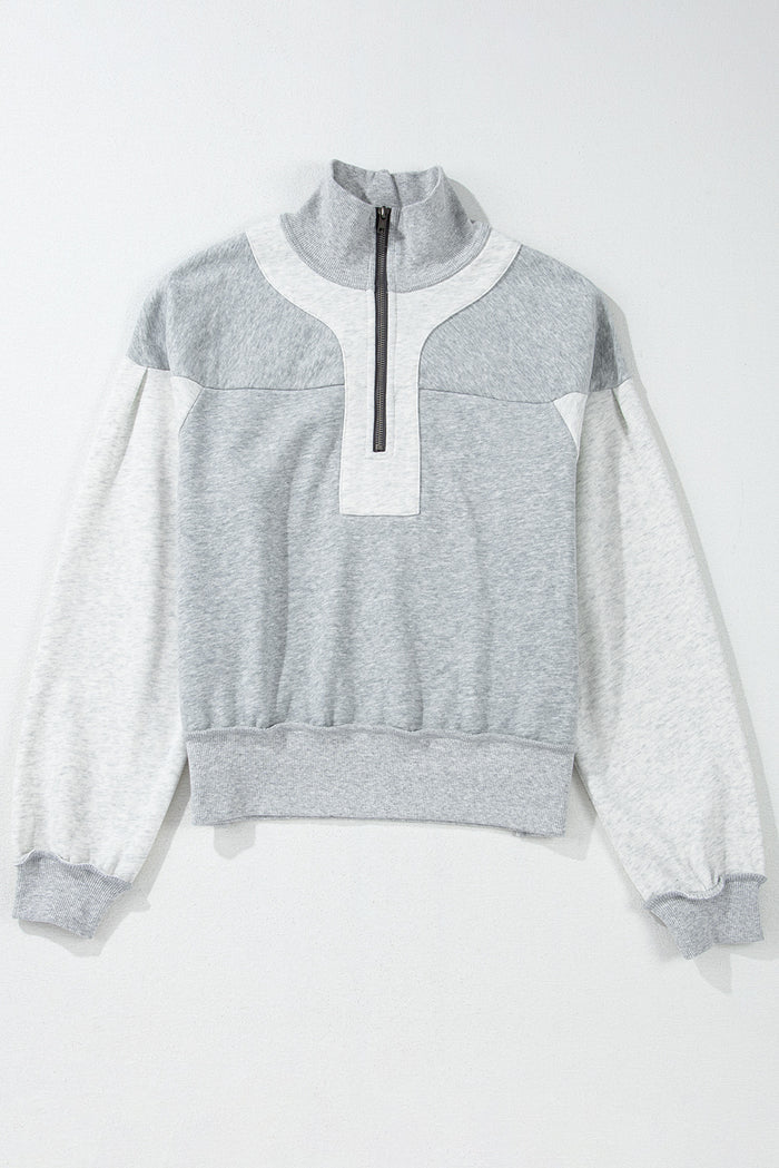 Sweat-shirt gris à demi-fermeture éclair et épaules tombantes avec fentes latérales