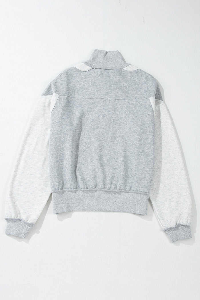 Sweat-shirt gris à demi-fermeture éclair et épaules tombantes avec fentes latérales