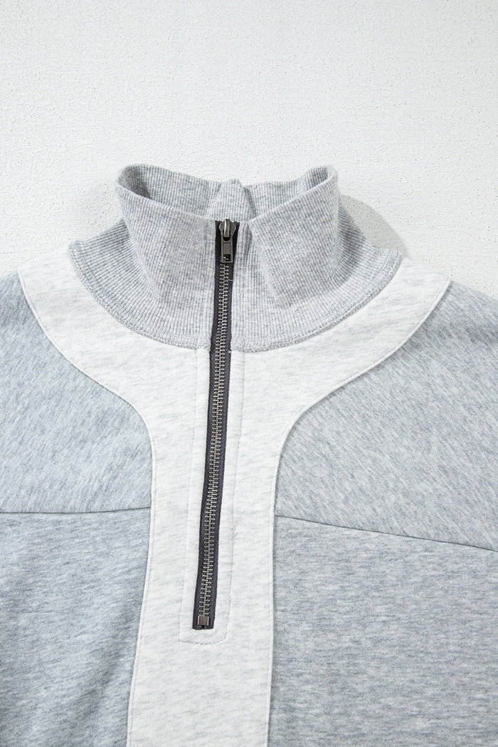 Sweat-shirt gris à demi-fermeture éclair et épaules tombantes avec fentes latérales