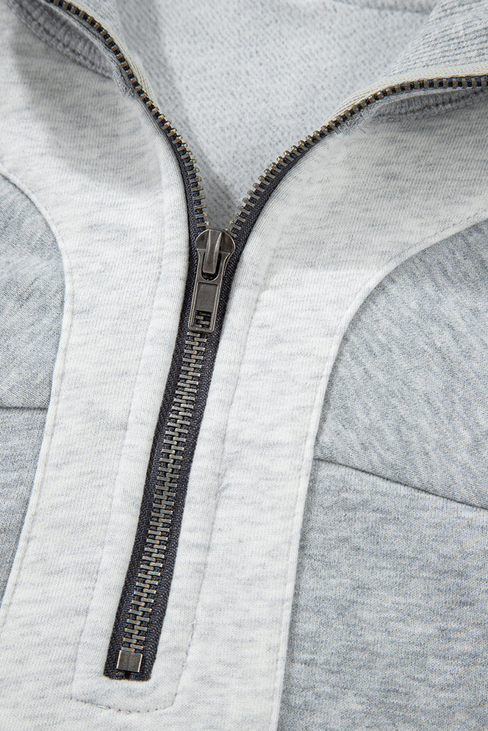 Sweat-shirt gris à demi-fermeture éclair et épaules tombantes avec fentes latérales