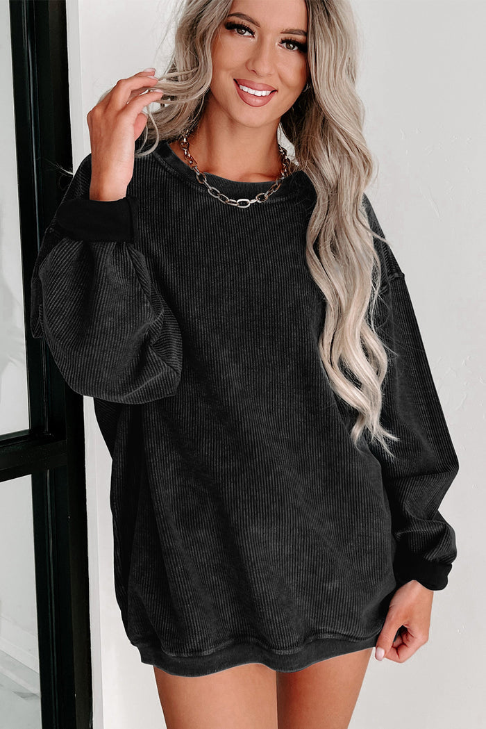 Sweat-shirt noir à col rond en tricot côtelé uni