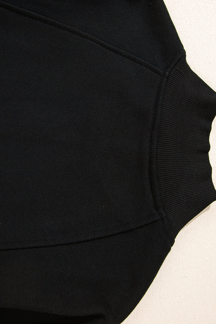 Sweat-shirt noir à col zippé et épaules tombantes