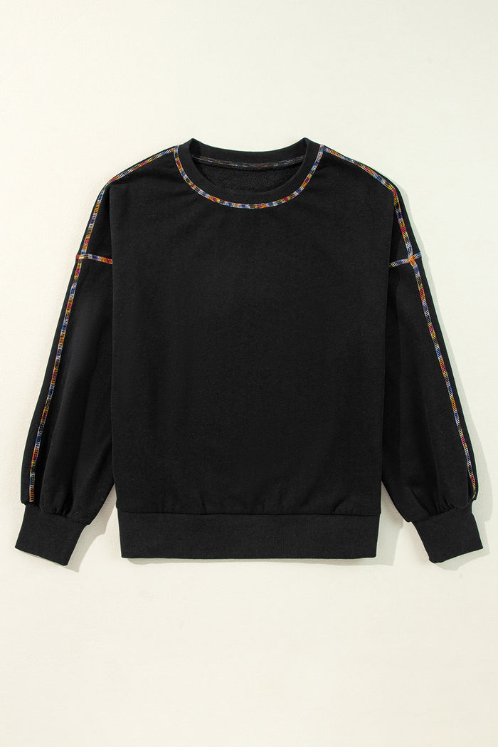 Sweat-shirt noir à épaules tombantes et bordure arc-en-ciel contrastée