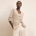 Front image of a woman wearing the Tali Cardigan in Tan | Lead