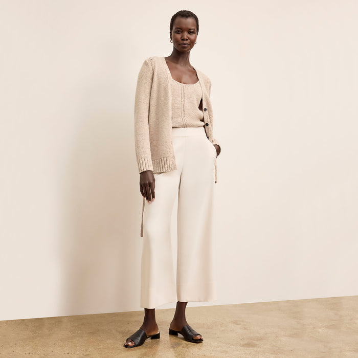 Front image of a woman wearing the Tali Cardigan in Tan