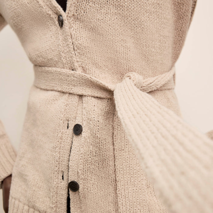 Front image of a woman wearing the Tali Cardigan in Tan