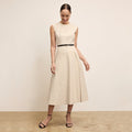 front image of a woman wearing the tati dress in linen stripe | Lead