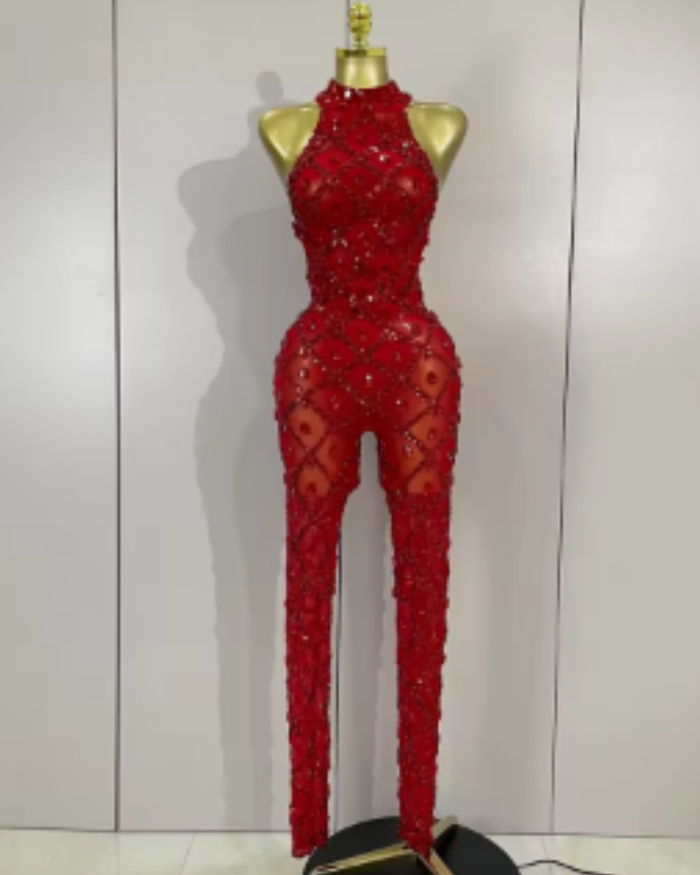 Teyah wearing a sparkly red diamonds mesh see through jumpsuit for a luxury prom look.