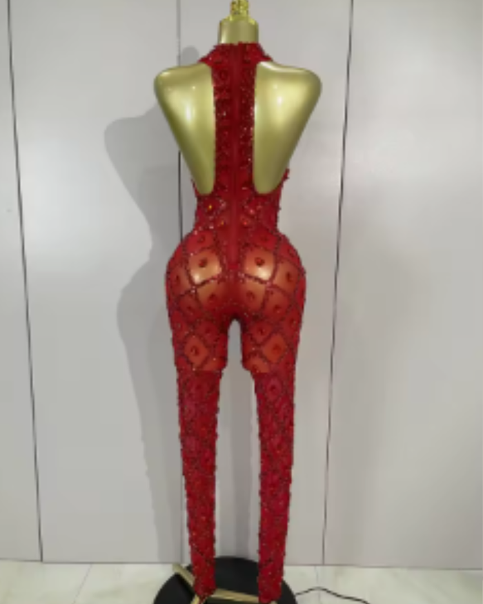 Teyah wearing a sparkly red diamonds mesh see through jumpsuit for a luxury prom look.