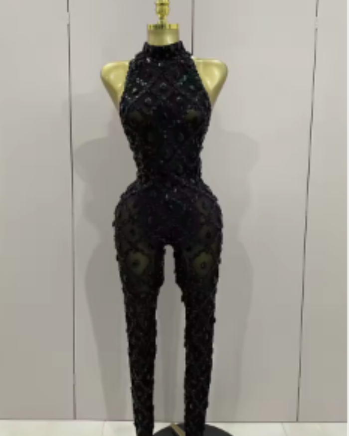 Teyah wearing a sparkly red diamonds mesh see through jumpsuit for a luxury prom look.