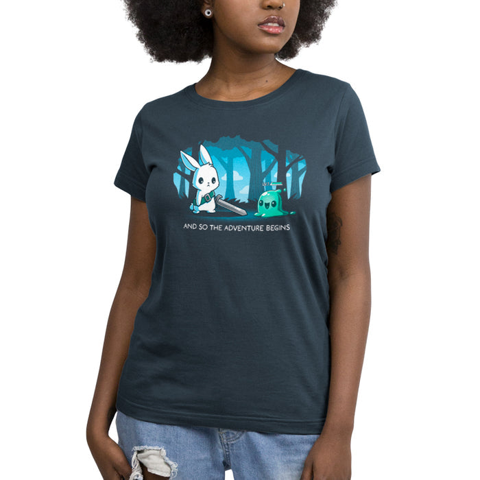 Premium Cotton T-shirt_TeeTurtle The Adventure Begins denim blue t-shirt featuring a cartoon rabbit brandishing a sword facing a small green slime creature labeled 'LV.1' in a forest. The text below reads, "AND SO THE ADVENTURE BEGINS."