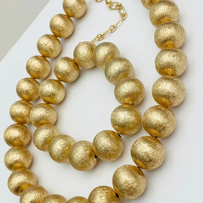 chic gold beaded statement necklace