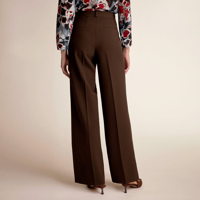 A woman wearing brown pants