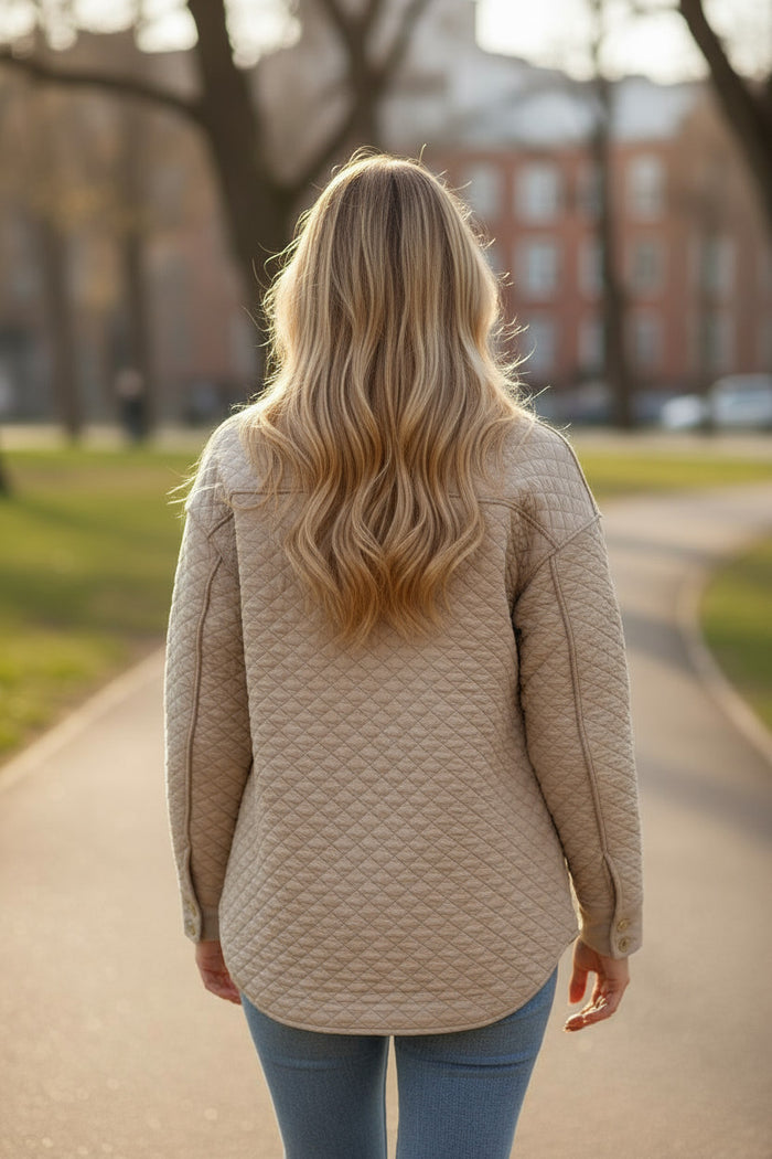 Veste matelassée boutonnée de couleur unie