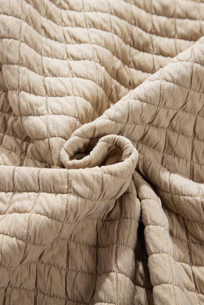 Veste matelassée boutonnée de couleur unie