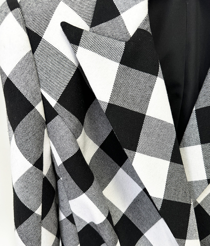 women’s blazer in black and white checkered pattern with buckle